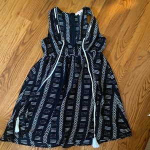 Black and white babydoll dress with tassels